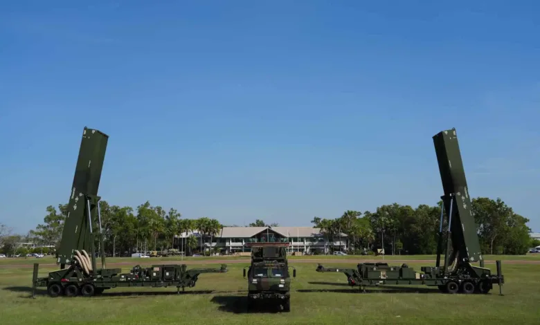 Australian Army NASAMS air defense system on display outdoors against a clear blue sky.