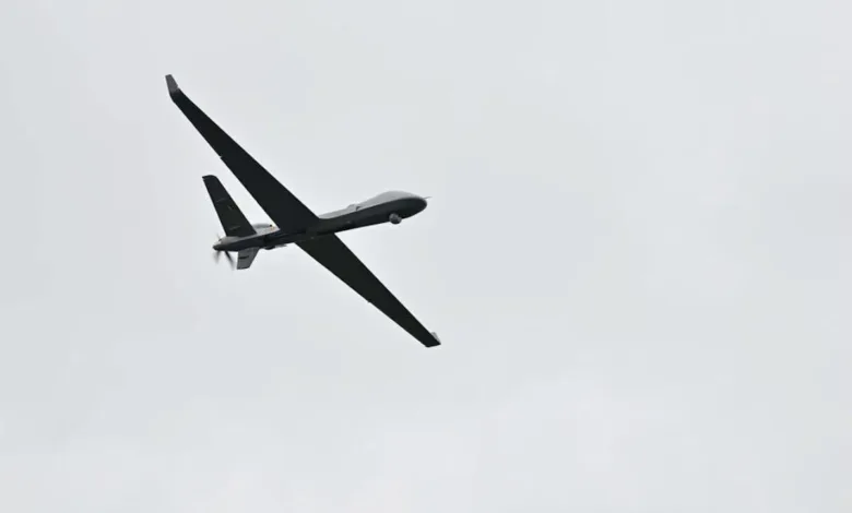 Belgian SkyGuardian RPAS in flight against a cloudy sky.