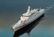 Croatian Navy ship sailing on water, featuring the Croatian flag on the bow.