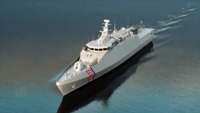 Croatian Navy ship sailing on water, featuring the Croatian flag on the bow.