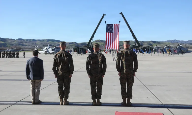Marines stand at attention during HMLA-169 change of command ceremony.