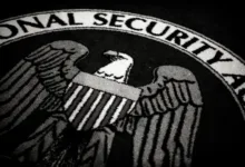 National Security Agency seal with eagle and shield, black and white image.