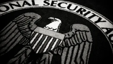 National Security Agency seal with eagle and shield, black and white image.