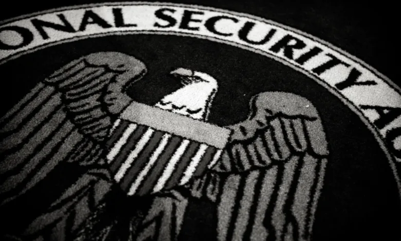 National Security Agency seal with eagle and shield, black and white image.