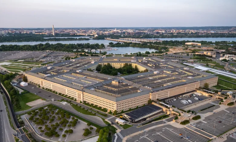 Aerial view of The Pentagon building in Arlington, Virginia, with Washington D.C. in the background.