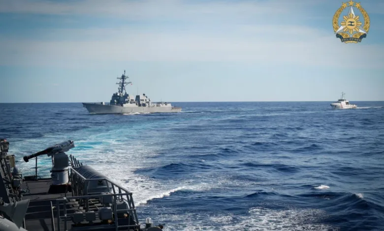 Philippine Navy ships sailing on the ocean under a blue sky, with Philippine Navy logo.