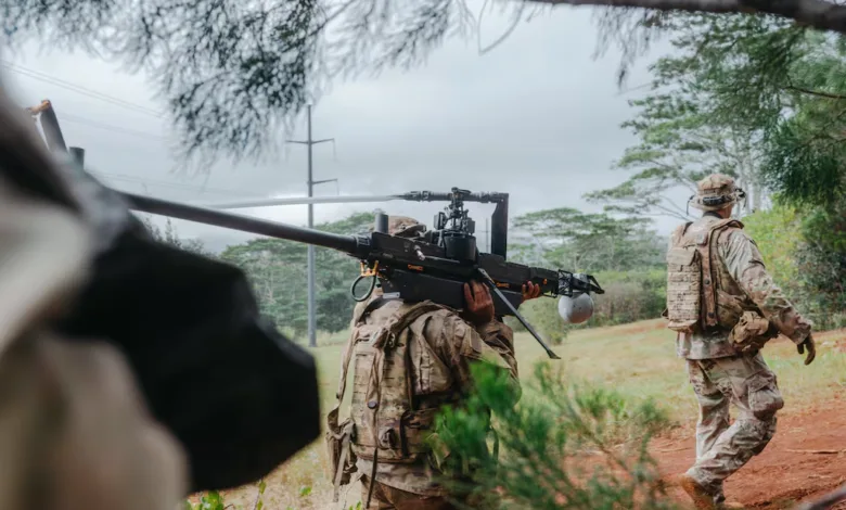 Soldier carries a weapon system on his shoulder during training exercise.