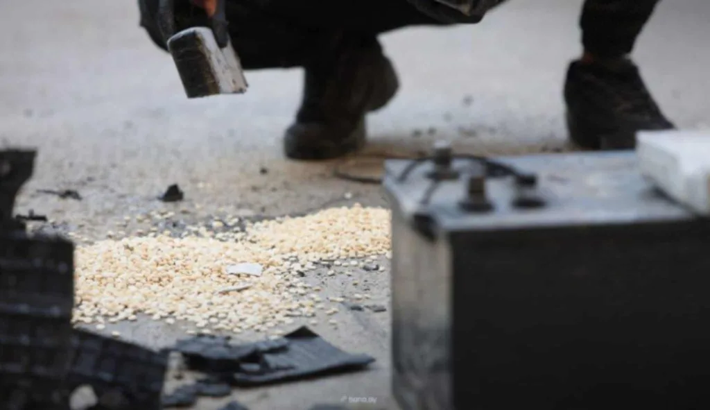 Man dismantling drug smuggling equipment, Syria airstrikes aftermath.