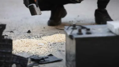 Man dismantling drug smuggling equipment, Syria airstrikes aftermath.
