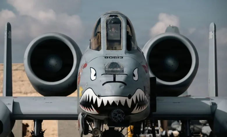 A-10 Thunderbolt II attack aircraft with shark teeth nose art. Close-up view of the cockpit and engines.