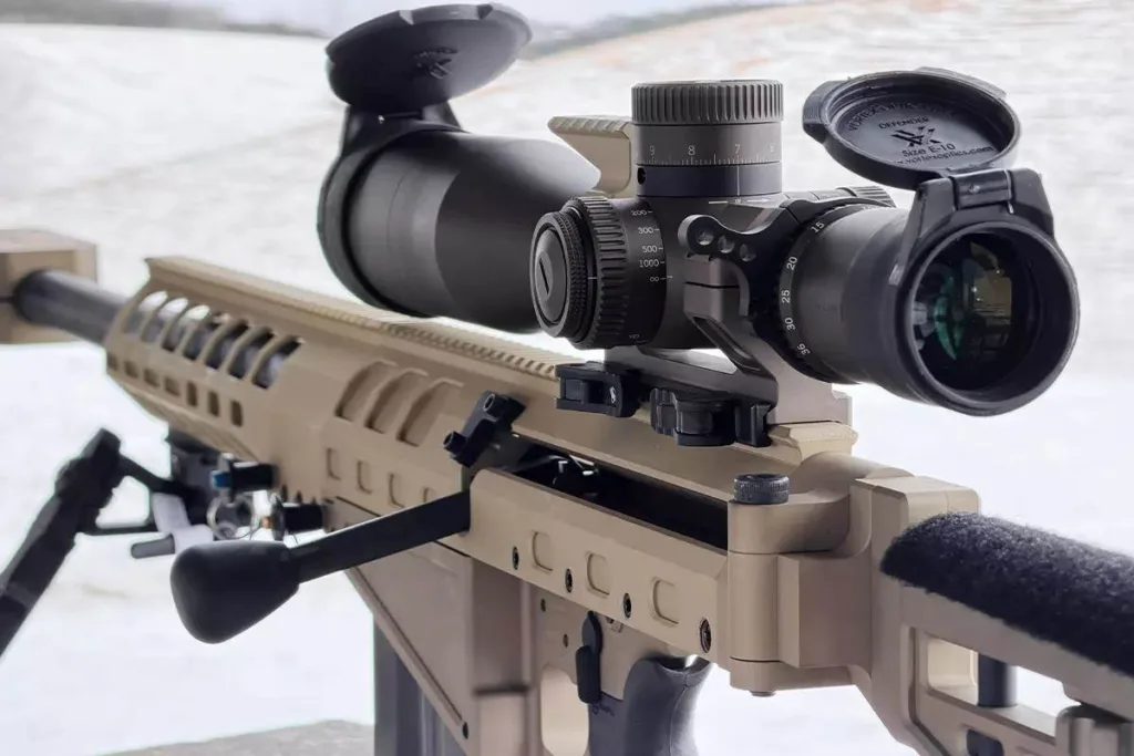 Auto-Ordnance Thompson TAO50 .50 BMG rifle with scope, bipod, and tan chassis.