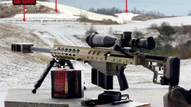 .50 BMG Auto-Ordnance Thompson TAO50 rifle with scope, bipod, and ammunition on a snowy range with distance markers.