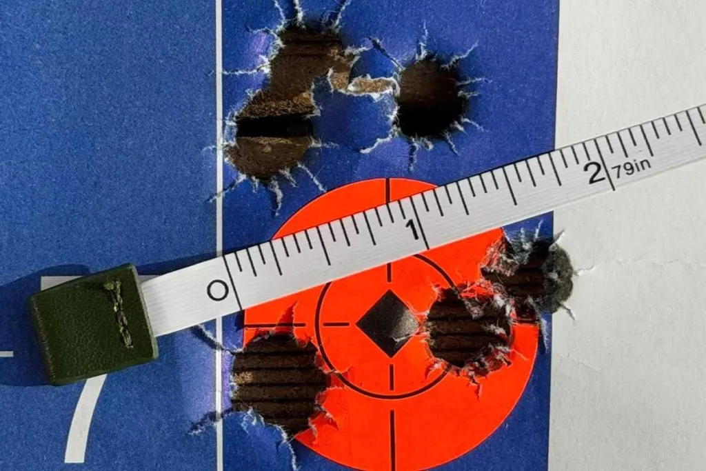 Target with bullet holes, measured at 2.79 inches. Auto-Ordnance Thompson TAO50 .50 BMG Rifle accuracy test.