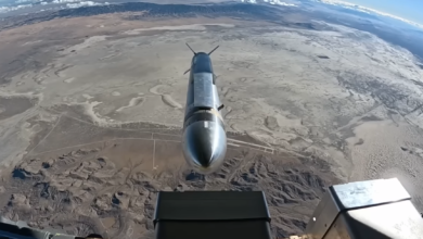 Hypersonic missile over desert landscape viewed from aircraft.