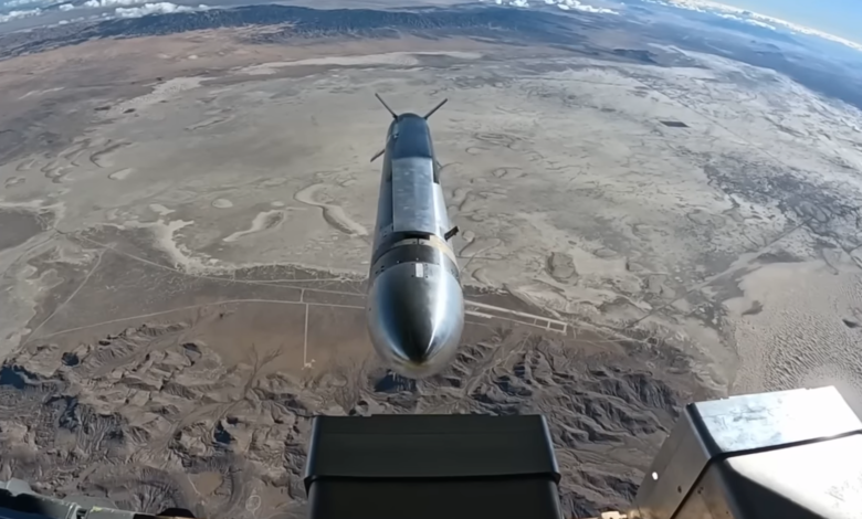 Hypersonic missile over desert landscape viewed from aircraft.