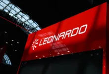 Leonardo company logo on a red display at an event.