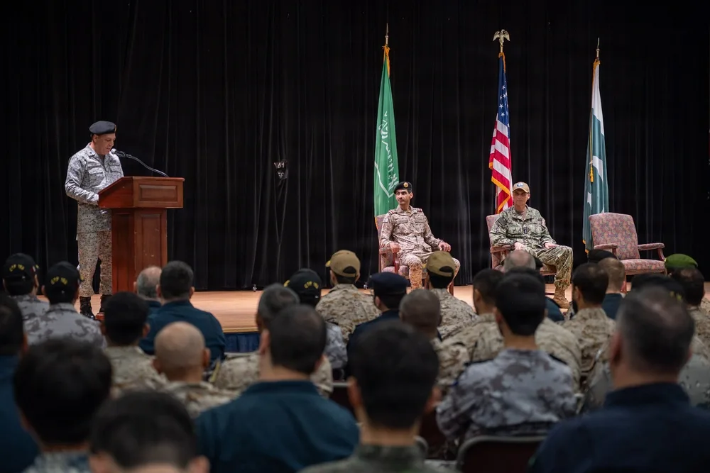 Pakistan Navy assumes command of Combined Task Force 150 during ceremony with flags displayed.