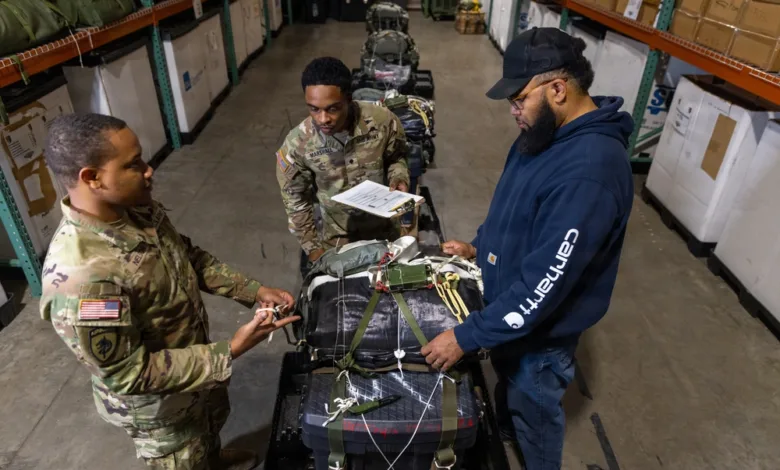 Soldiers inspect equipment at 3rd Special Forces Group's Operation Ghost Rig exercise.