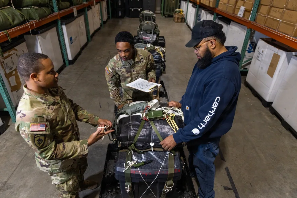 Soldiers inspect equipment at 3rd Special Forces Group's Operation Ghost Rig exercise.