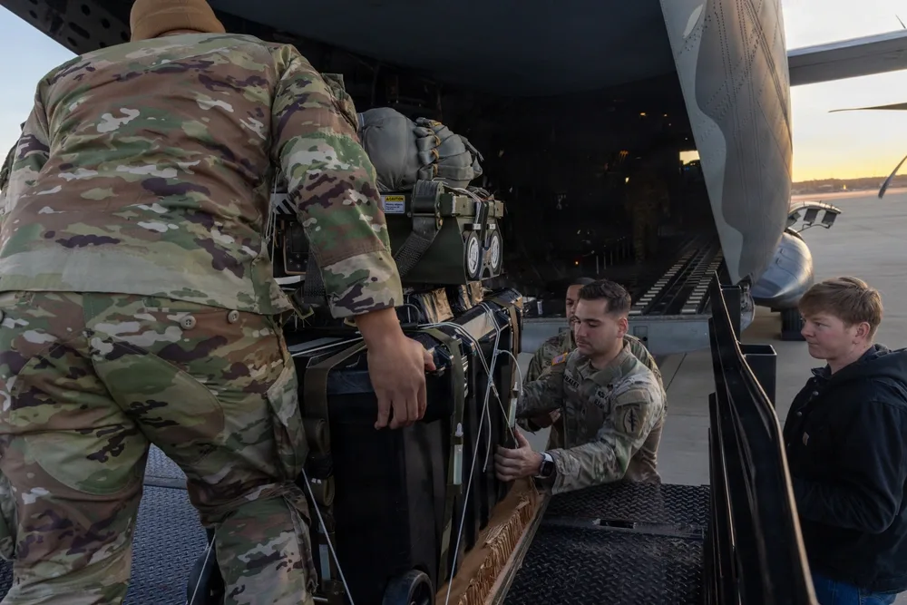 Soldiers load equipment onto a military aircraft during Exercise Operation Ghost Rig.
