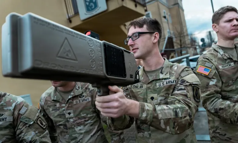 US Army soldier aiming Dronebuster anti-drone weapon. Counter UAS technology.