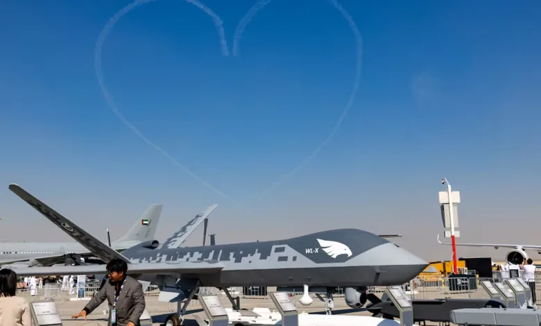 WL-X drone on display with heart skywriting at airshow.