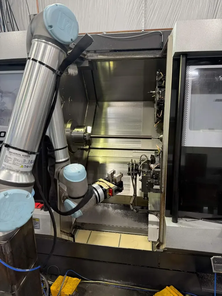 Automated CNC machine tending with Universal Robots collaborative robot arm.