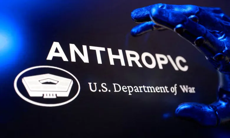 Anthropic logo with U.S. Department of War and robotic hand.
