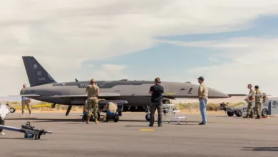 RQ-41 Mojave drone being prepped on the tarmac by ground crew.